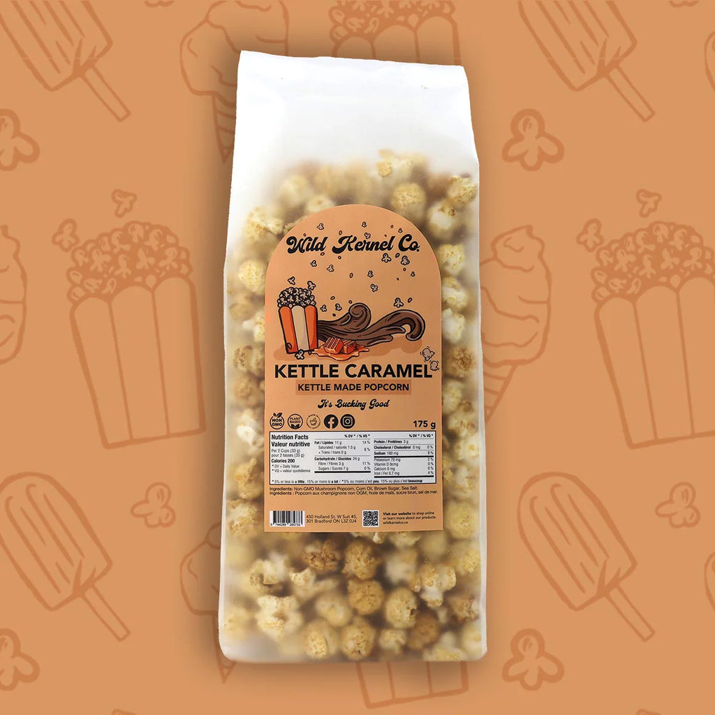 Bag of kettle caramel popcorn with a visible label on an orange background with popcorn illustrations.