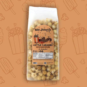 Bag of kettle caramel popcorn with a visible label on an orange background with popcorn illustrations.