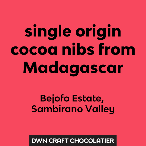 Text on a red background about single origin cocoa nibs from Madagascar with DWN Craft Chocolatier branding.