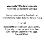 Load image into Gallery viewer, black text on a white background that reads, &quot;Venezuela 72% dark chocolate  Hacienda Campesina Cuyagua  tasting notes: earthy, floral with an overwhelming fudge-brownie flavour / 75g   1  of  55 Ingredients: Cocoa Beans, Cocoa Butter,  Sugar. May contain traces of Nuts, Tree  Nuts, Peanuts, Sesame Seeds, Eggs,  Soy and Wheat.&quot;
