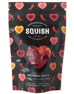 Load image into Gallery viewer, Squish candy package with heart designs and branding on a black background

