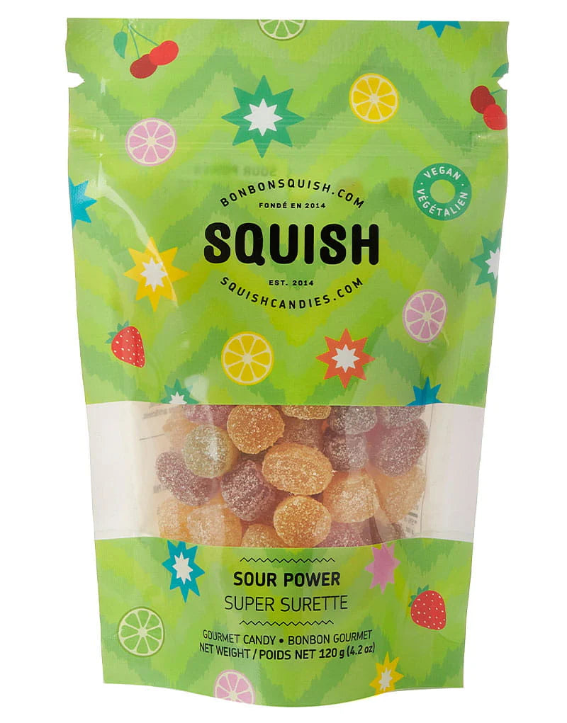 Green packaging of Squish gummy candies with colorful designs and text.