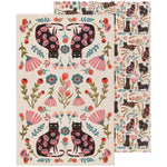 Load image into Gallery viewer, set of two cream tea towels featuring black cats surrounded by colourful floral patterns in pink, coral, teal, and olive green, with one towel displaying a symmetrical design of four cats and the other featuring cats in various poses
