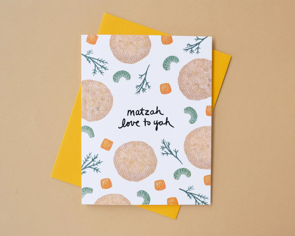 Card with matzah design and text 'matzah love to yah' on a beige background