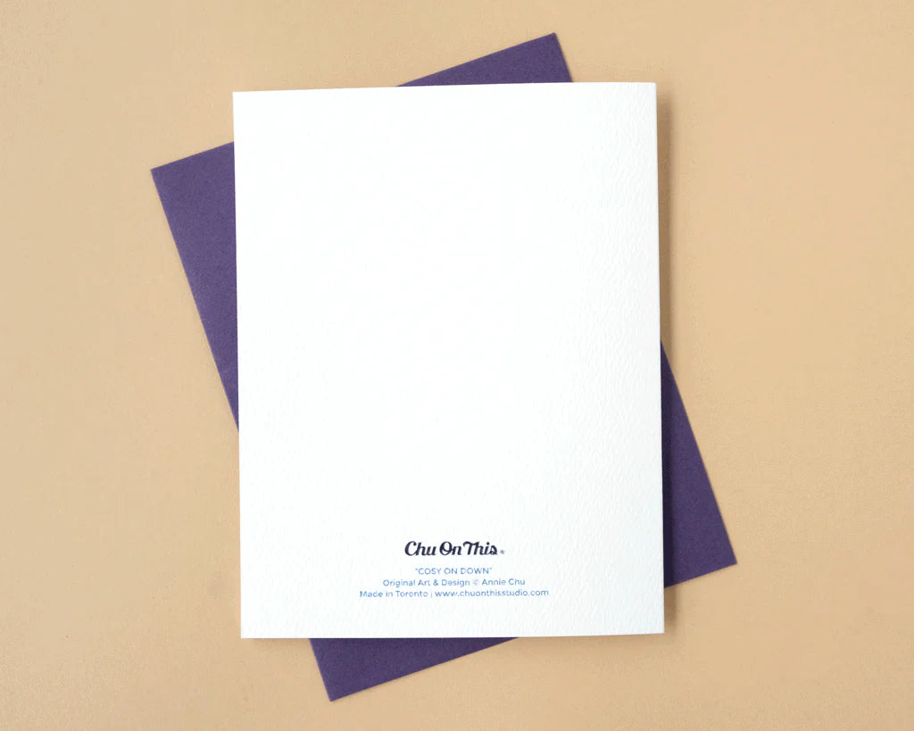 White card back with purple envelope on a beige background