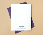 Load image into Gallery viewer, White card back with purple envelope on a beige background
