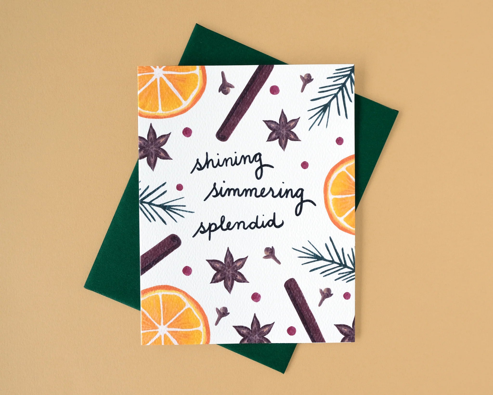 Greeting card with holiday spice decorative elements and text on a beige background
