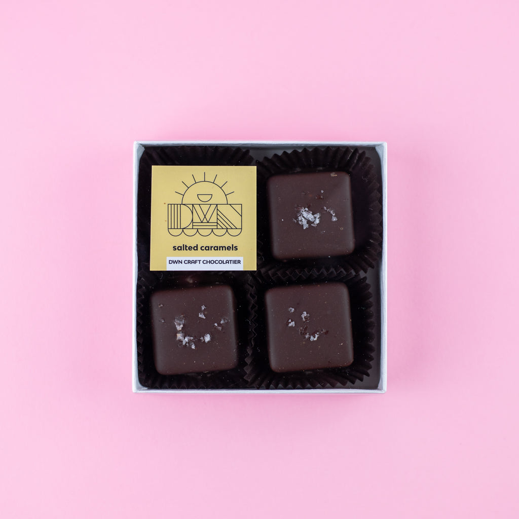 box of dark chocolate salted caramels with a DWN Chocolate label on a pink background