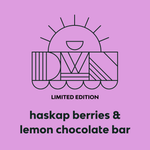 Load image into Gallery viewer, limited edition haskap berries &amp; lemon chocolate bar on a purple background with DWN sun logo
