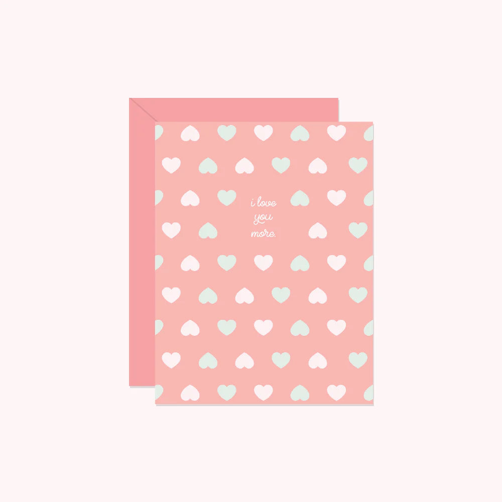 Pink card with heart patterns and text on a white background