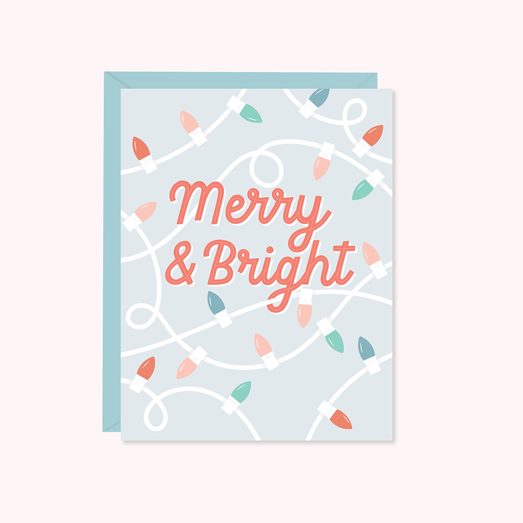 A greeting card with a 'Merry & Bright' text design, featuring a pattern of Christmas lights on a light background.