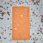 Load image into Gallery viewer, back of milk chocolate bar with sea salt 
