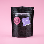 Load image into Gallery viewer, black DWN pouch with a milk chocolate chip sticker
