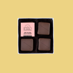 Load image into Gallery viewer, four pieces of pecan caramels in a box with label
