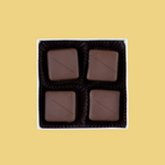 Load image into Gallery viewer, four pieces of pecan caramels in a box

