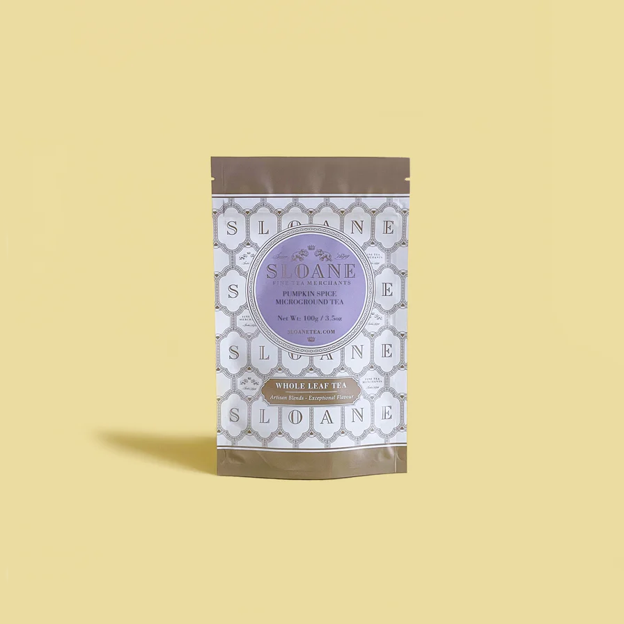 tea pouch with a geometric pattern and purple label on a yellow background
