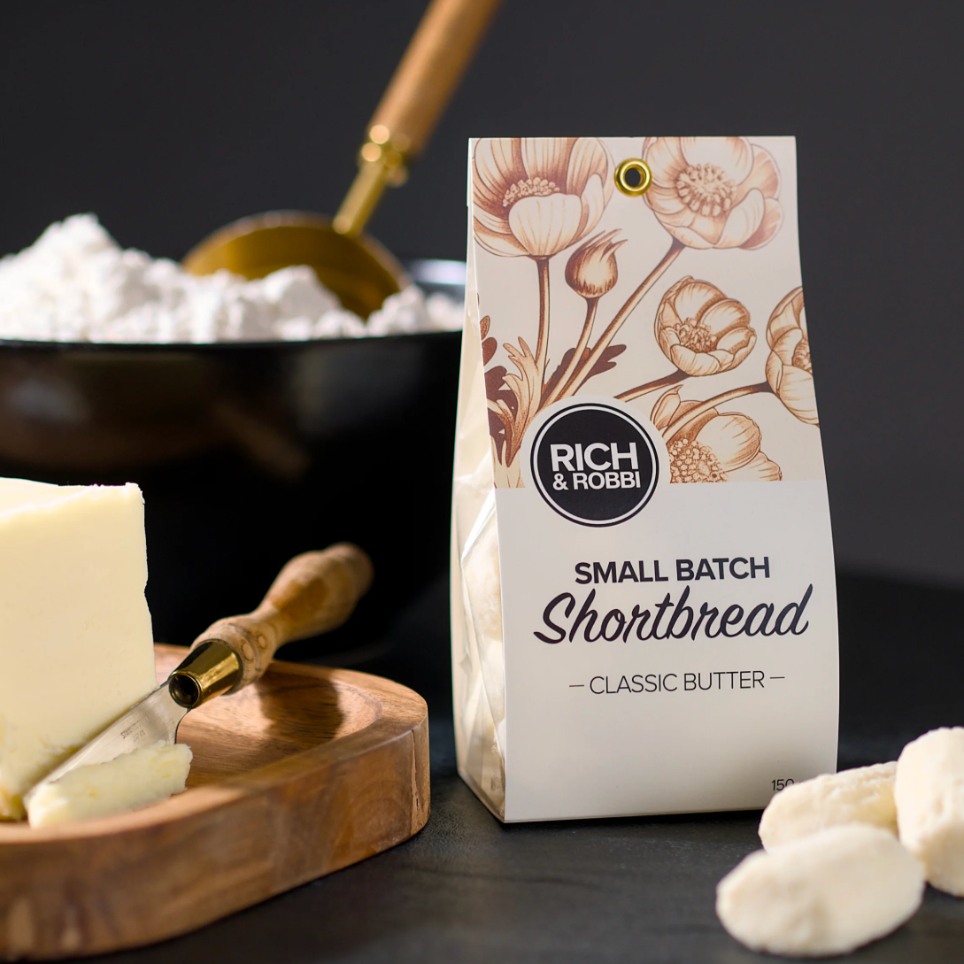 shortbread packaging with a floral design on a dark background