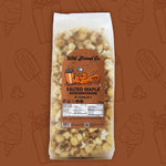 Load image into Gallery viewer, Bag of salted maple kettle made popcorn with a brown label on a brown background.
