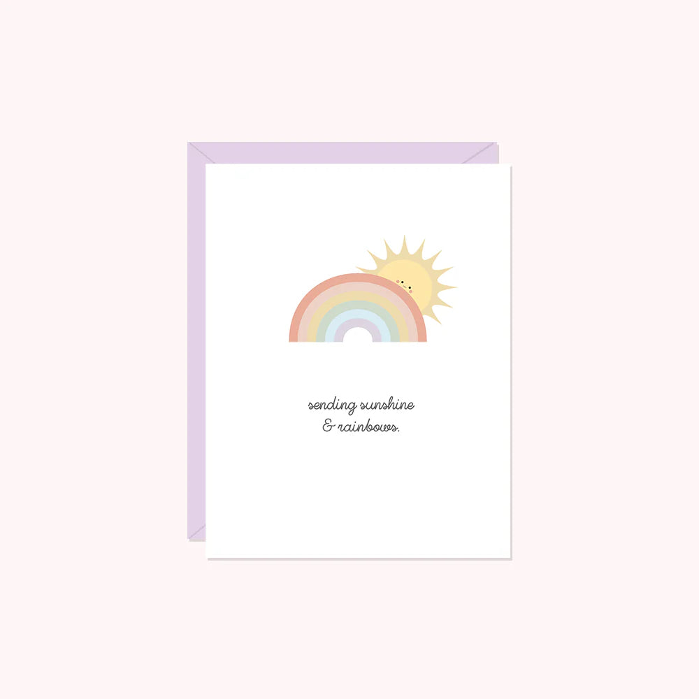 Card with a rainbow and sun illustration on a light pink background