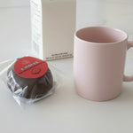 Load image into Gallery viewer, s'mores meltaway on a marble counter beside a mug
