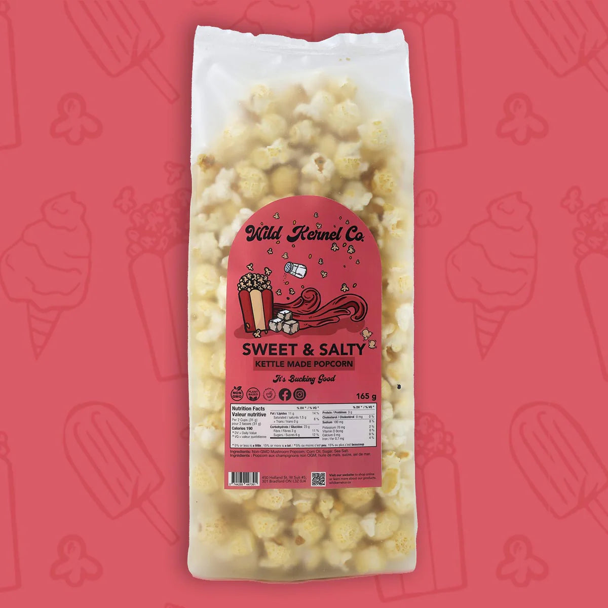 Bag of sweet and salty kettle corn with a pink label on a red background with ice cream cone illustrations.