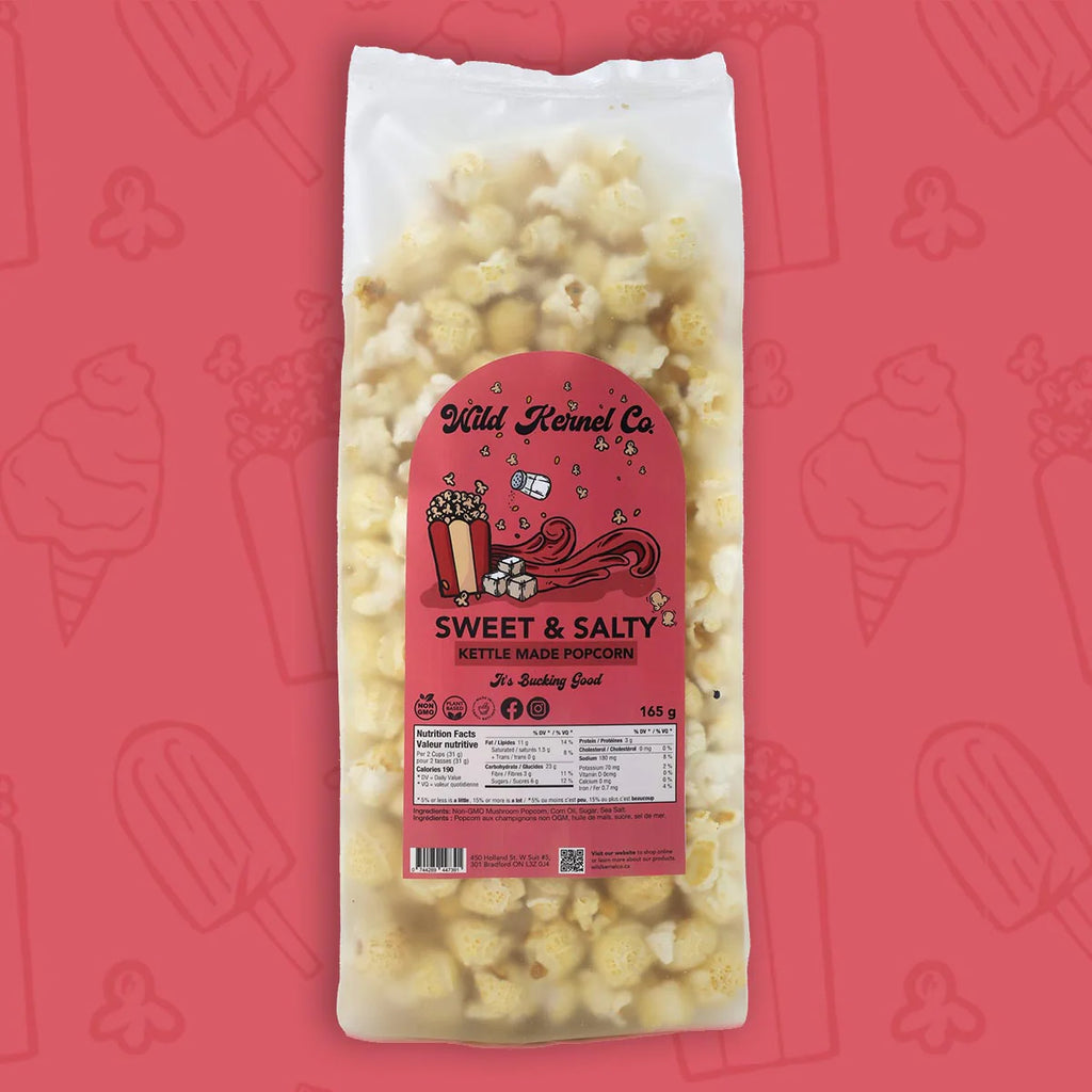 Bag of sweet and salty kettle corn with a pink label on a red background with ice cream cone illustrations.