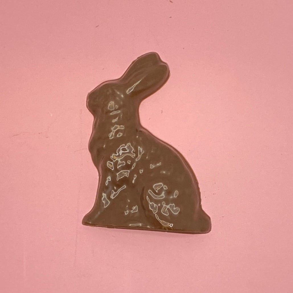 milk chocolate rabbit on a pink background