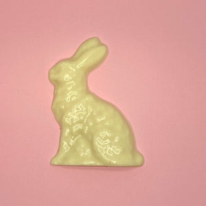 white chocolate rabbit on a pink background