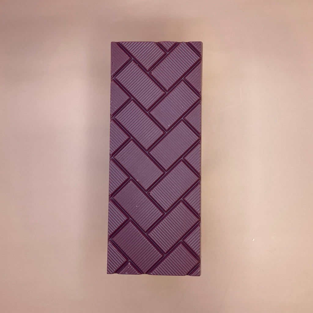 berry fizz chocolate bar on a peach background