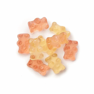 a pile of sparkling bear gummies on a white background