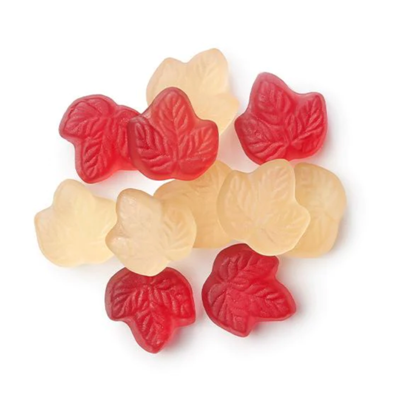 a pile of maple-shaped gummies on a white background