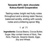 Load image into Gallery viewer, black text on a white label that reads, &quot;Tanzania 80% dark chocolate  Kokoa Kamili Cooperative  Tasting notes: bright red fruity notes throughout and a strong raisin flavour, balanced acidity, ending with woody  notes and a bittering spice/ 80g   1  of  71 Ingredients: Cocoa Beans, Cocoa Butter,  Sugar. May contain traces of Nuts, Tree  Nuts, Peanuts, Sesame Seeds, Eggs,  Soy and Wheat.&quot;
